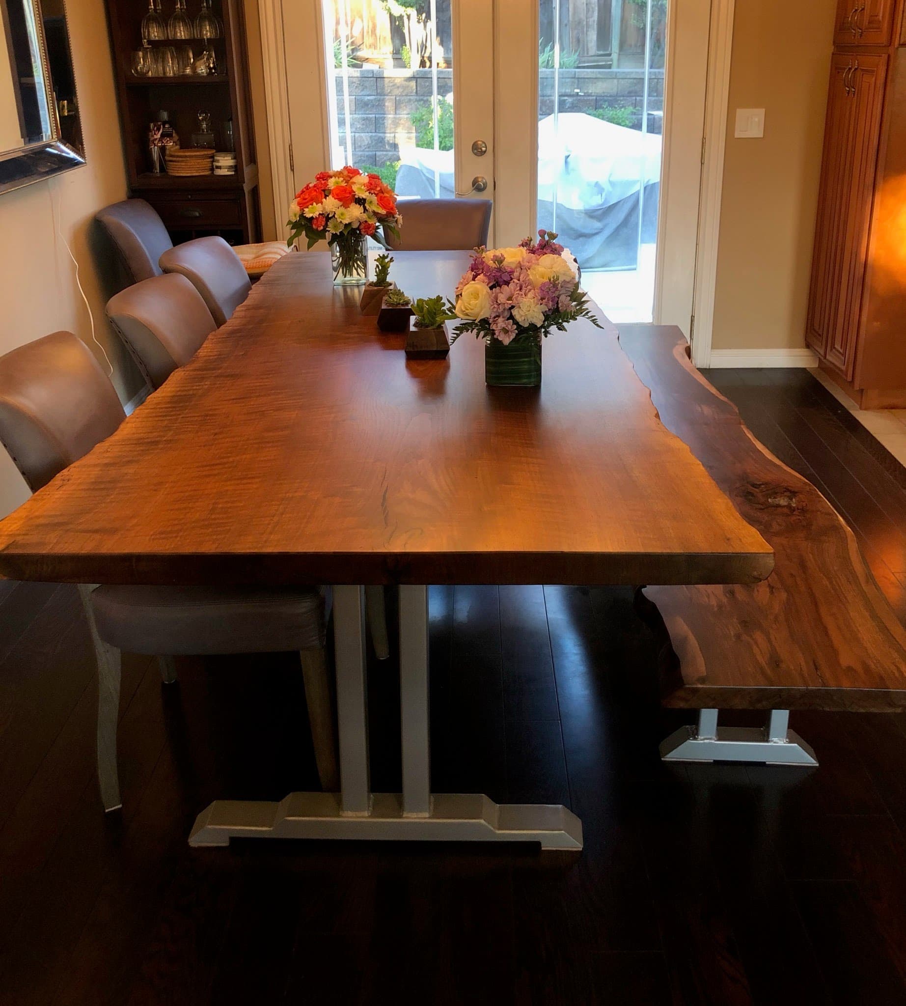 Live-edge walnut dining table with matching bench